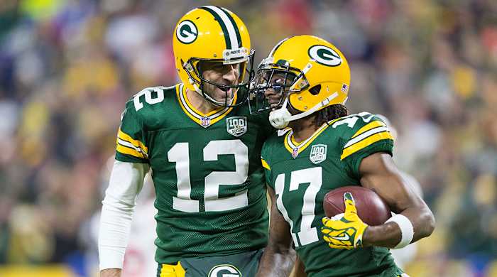 Packers quarterback Aaron Rodgers (12) celebrates with wide receiver Davante Adams (17) following a touchdown during the first quarter against the 49ers.